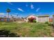 Well-maintained backyard with grass, a gazebo, and flower bushes at 332 N 25Th St, Mesa, AZ 85213
