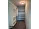 Walk-in closet with built-in shelving and ample storage space with neutral carpet at 332 N 25Th St, Mesa, AZ 85213