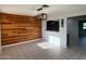 Cozy dining area with wood accent wall and modern light fixture, adjacent to the kitchen at 332 N 25Th St, Mesa, AZ 85213