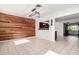 Dining room with wood accent wall, modern lighting, and tile flooring at 332 N 25Th St, Mesa, AZ 85213