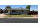 Charming single-story home featuring a well-maintained lawn and a welcoming covered porch area at 332 N 25Th St, Mesa, AZ 85213