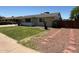 Cozy home featuring a lush lawn, a covered porch, and charming landscaping, creating inviting curb appeal at 332 N 25Th St, Mesa, AZ 85213