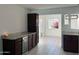 Kitchen area featuring a built-in wine cooler, granite countertops, and tiled flooring at 332 N 25Th St, Mesa, AZ 85213