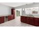 Eat-in kitchen offers a sleek design with granite counters and a wine refrigerator at 332 N 25Th St, Mesa, AZ 85213