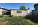 Exterior view of the wooden shed with a door and window in the backyard at 332 N 25Th St, Mesa, AZ 85213