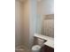 Cozy bathroom featuring a mirror, toilet, and shower/tub combo with a curtain at 37180 W Mondragone Ln, Maricopa, AZ 85138