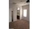 Bedroom featuring carpet floors, neutral walls, and an ensuite bath at 37180 W Mondragone Ln, Maricopa, AZ 85138