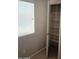 Bright closet features shelving with natural light from the window at 37180 W Mondragone Ln, Maricopa, AZ 85138