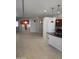 Stylish living area featuring tile flooring, pendant lighting, and neutral walls, creating a warm and inviting atmosphere at 37180 W Mondragone Ln, Maricopa, AZ 85138