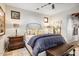 This cozy bedroom includes two windows, an area rug and a padded bench at 42171 N Saguaro Forest Dr, Scottsdale, AZ 85262