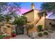 Stunning home showcasing a stucco exterior, well-manicured landscaping, and a welcoming stone pathway at 42171 N Saguaro Forest Dr, Scottsdale, AZ 85262