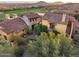 An inviting view of the home showcasing well-manicured desert landscaping and architecture at 42171 N Saguaro Forest Dr, Scottsdale, AZ 85262