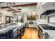 Bright and airy kitchen with stainless steel appliances, large island, and ample counter space at 42171 N Saguaro Forest Dr, Scottsdale, AZ 85262