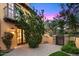 Beautiful outdoor patio features stone pavers and a lovely view through a set of french doors at 42171 N Saguaro Forest Dr, Scottsdale, AZ 85262