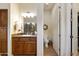 Bathroom featuring wooden cabinets, granite countertops, and seperate toilet room and shower at 4320 E Ficus Way, Gilbert, AZ 85298