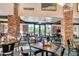 Well-lit dining area with tables, chairs, and views of the surrounding landscape at 4320 E Ficus Way, Gilbert, AZ 85298