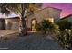 Attractive desert home featuring a stone entryway and mature landscaping at 4320 E Ficus Way, Gilbert, AZ 85298