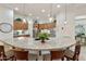 Spacious kitchen island with granite countertops, pendant lighting, and seating for four at 4320 E Ficus Way, Gilbert, AZ 85298