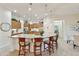 Bright kitchen with granite countertops, seating at the island, and modern lighting at 4320 E Ficus Way, Gilbert, AZ 85298