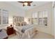 Comfortable bedroom featuring soft carpet, a decorative headboard, and plantation shutters at 4320 E Ficus Way, Gilbert, AZ 85298