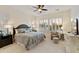 Serene main bedroom featuring neutral tones, shutters, and a comfortable seating area at 4320 E Ficus Way, Gilbert, AZ 85298