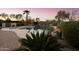 Tranquil pool area showcases lush landscaping, a spa, and a peaceful atmosphere, perfect for relaxation at 4320 E Ficus Way, Gilbert, AZ 85298