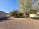 Spacious backyard with desert landscaping and a covered patio, perfect for outdoor enjoyment at 4643 E Cherry Hills Dr, Chandler, AZ 85249