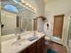 Well-lit bathroom featuring double sinks, wood cabinets, and neutral walls for a calming atmosphere at 4643 E Cherry Hills Dr, Chandler, AZ 85249