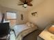 Bedroom featuring a ceiling fan, window with blinds, and carpet at 4643 E Cherry Hills Dr, Chandler, AZ 85249