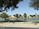Scenic view of the community lake and green space, offering a peaceful outdoor retreat for residents to enjoy nature at 4643 E Cherry Hills Dr, Chandler, AZ 85249