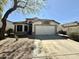 Charming single-story home with well-maintained front yard and attached two-car garage at 4643 E Cherry Hills Dr, Chandler, AZ 85249