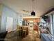 Kitchen with stainless steel refrigerator, wooden cabinets, center island, tile floor, and eat in dining area at 4643 E Cherry Hills Dr, Chandler, AZ 85249