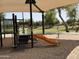 Community playground featuring slides, climbing structures, and a covered area, set in a well-maintained park with trees and green space at 4643 E Cherry Hills Dr, Chandler, AZ 85249