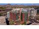 Stunning aerial view of a modern building complex with rooftop amenities and scenic mountain backdrop at 4808 N 24Th St # 1427, Phoenix, AZ 85016