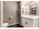 Cozy bathroom with modern vanity, neutral color palette, and dark wood floors at 4808 N 24Th St # 1427, Phoenix, AZ 85016