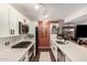 Modern kitchen with white cabinetry, subway tile backsplash, and a large island with bar seating at 4808 N 24Th St # 1427, Phoenix, AZ 85016