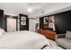 Inviting main bedroom featuring dark accent wall, ensuite, and modern decor at 4808 N 24Th St # 1427, Phoenix, AZ 85016