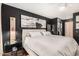 Spacious main bedroom with dark walls, modern decor, and a walk-in closet at 4808 N 24Th St # 1427, Phoenix, AZ 85016