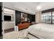 Main bedroom boasts dark accent wall, wood dresser, and natural light at 4808 N 24Th St # 1427, Phoenix, AZ 85016