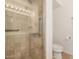 Modern shower with glass door and stainless steel fixtures at 4808 N 24Th St # 1427, Phoenix, AZ 85016