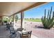 Inviting outdoor space with seating and a view of the well-manicured golf course at 511 W Cherrywood Dr, Sun Lakes, AZ 85248