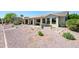 Beautiful home exterior with a low maintenance desert landscape, perfect for outdoor enjoyment at 511 W Cherrywood Dr, Sun Lakes, AZ 85248