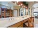 A spacious bathroom features an oversized vanity with a large mirror, sauna, and jacuzzi tub at 511 W Cherrywood Dr, Sun Lakes, AZ 85248