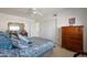 Inviting bedroom with a comfortable bed, soft lighting, and ample closet space at 511 W Cherrywood Dr, Sun Lakes, AZ 85248