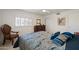 Comfortable bedroom with lots of natural light streaming in through plantation shutters at 511 W Cherrywood Dr, Sun Lakes, AZ 85248