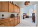 Hallway with plenty of cabinet storage and an open doorway to a bedroom at 511 W Cherrywood Dr, Sun Lakes, AZ 85248