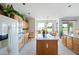 Bright kitchen featuring a center island, modern appliances, and a view of the lush golf course at 511 W Cherrywood Dr, Sun Lakes, AZ 85248