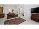 Bright living room featuring multiple entryways, neutral carpet, and stylish furnishings at 511 W Cherrywood Dr, Sun Lakes, AZ 85248