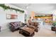 Inviting living room featuring cozy sofas, a wooden coffee table, and decorous wall art at 511 W Cherrywood Dr, Sun Lakes, AZ 85248