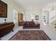 Bright living room featuring a large arched window, plush sofa, and elegant furnishings at 511 W Cherrywood Dr, Sun Lakes, AZ 85248